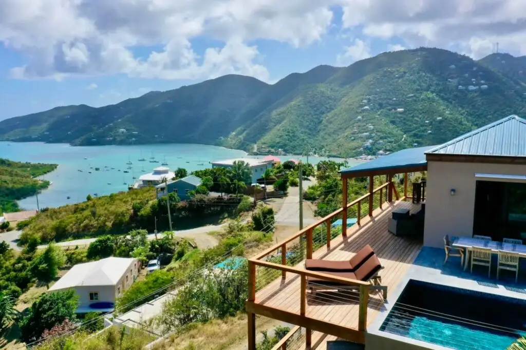 Scenic mountain view from the house, featuring a rooftop pool and a stunning beach in Coral Bay.